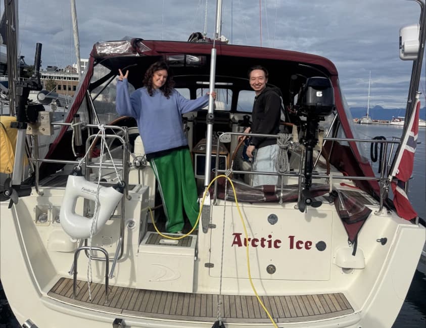 The crew on the stern of the Arctic Ice sailing yacht